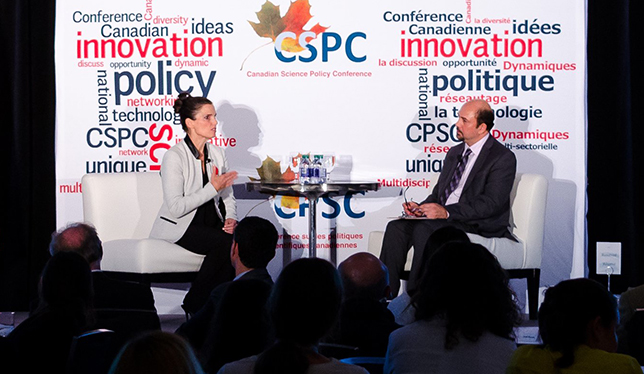 Science Minister Kirsty Duncan speaks with CSPC president Mehrdad Hariri. Photo courtesy of the Canadian Science Policy Conference.